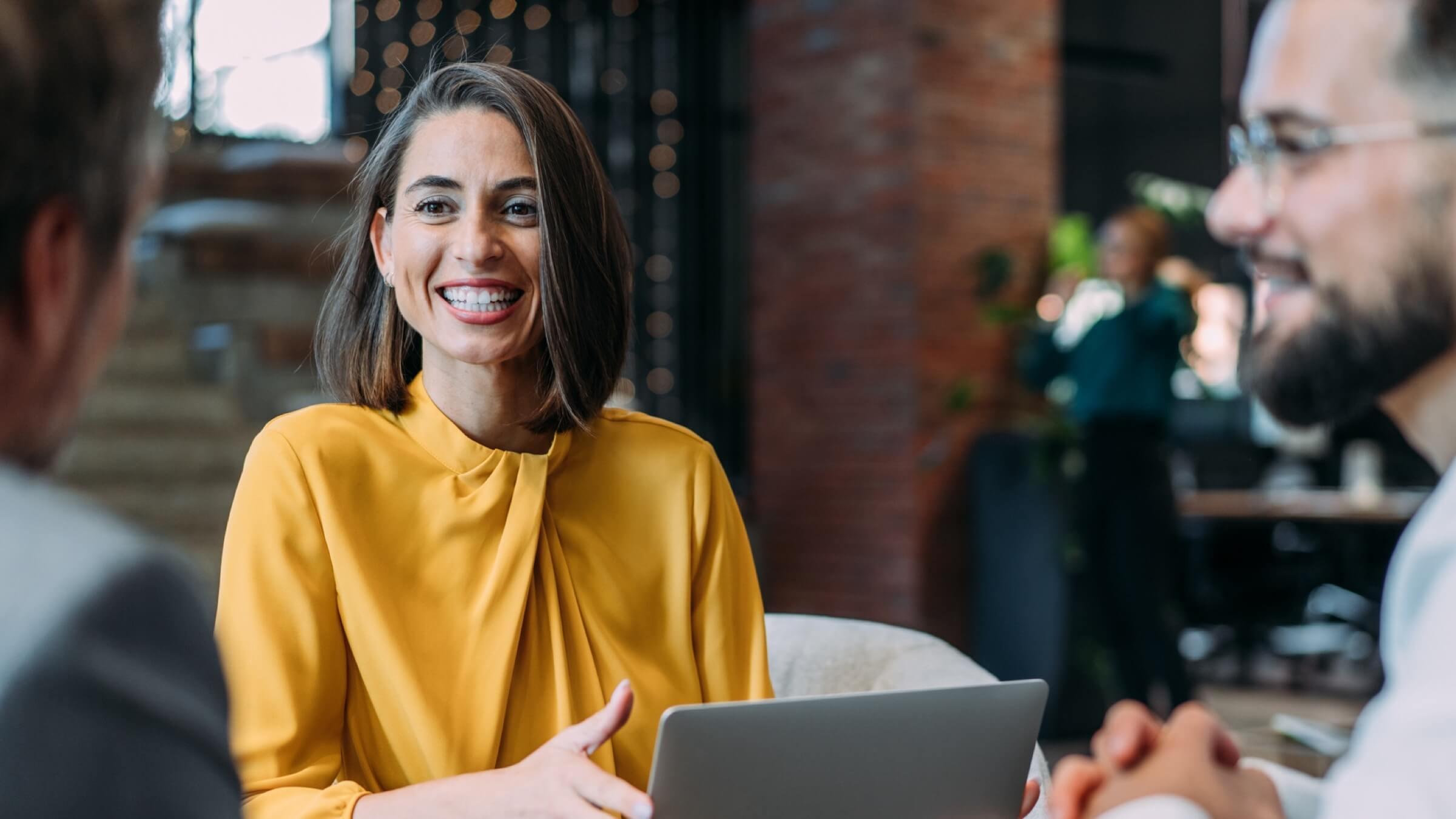 business group talking in office header@2x