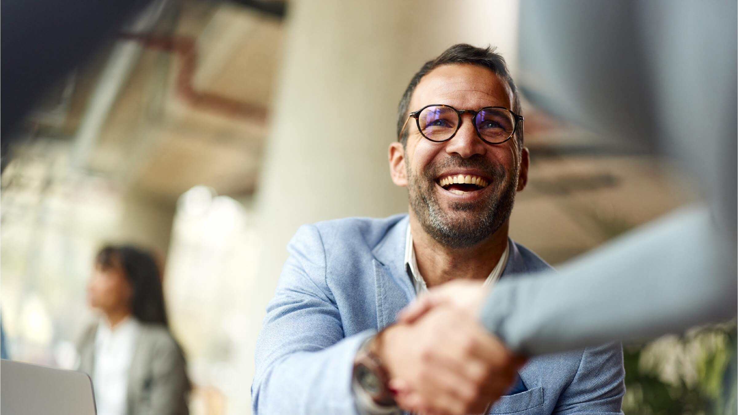 businessman shaking hands header