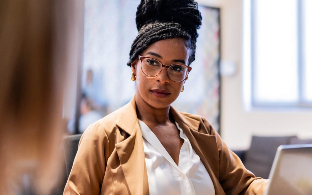 businesswoman intently listening to coworker