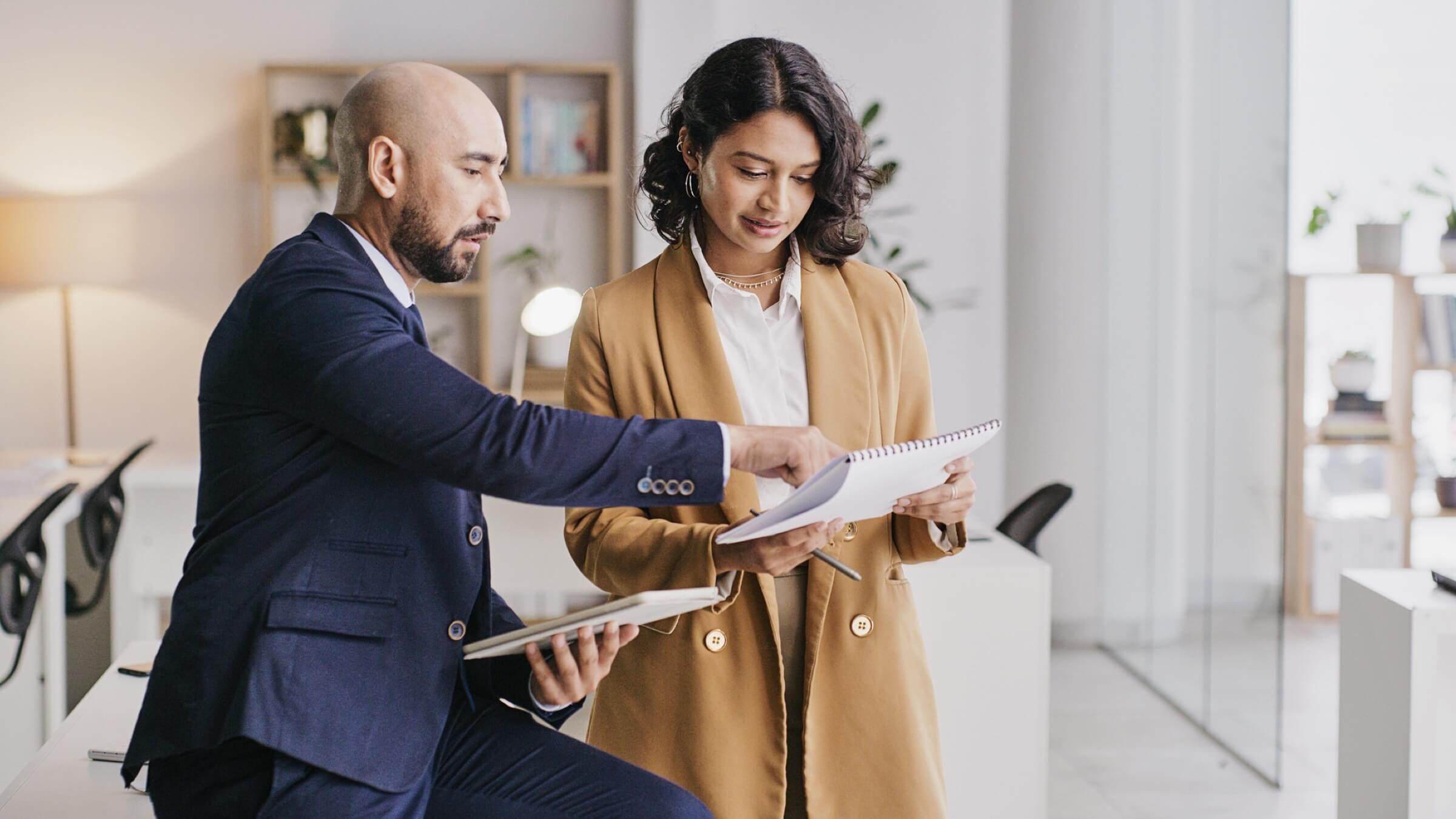 man and woman discussing project header