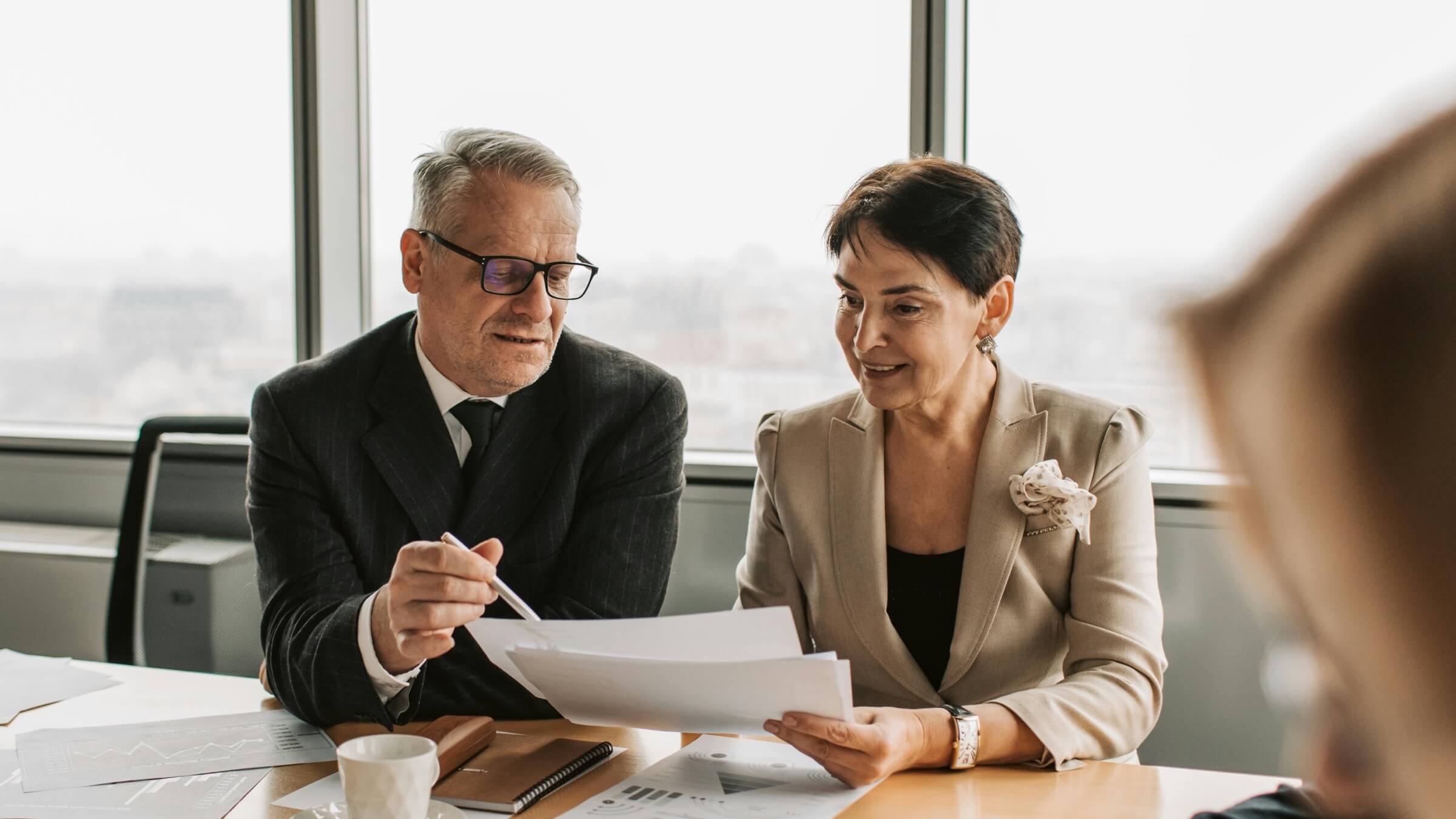 man and woman business meeting header man and woman business meeting header