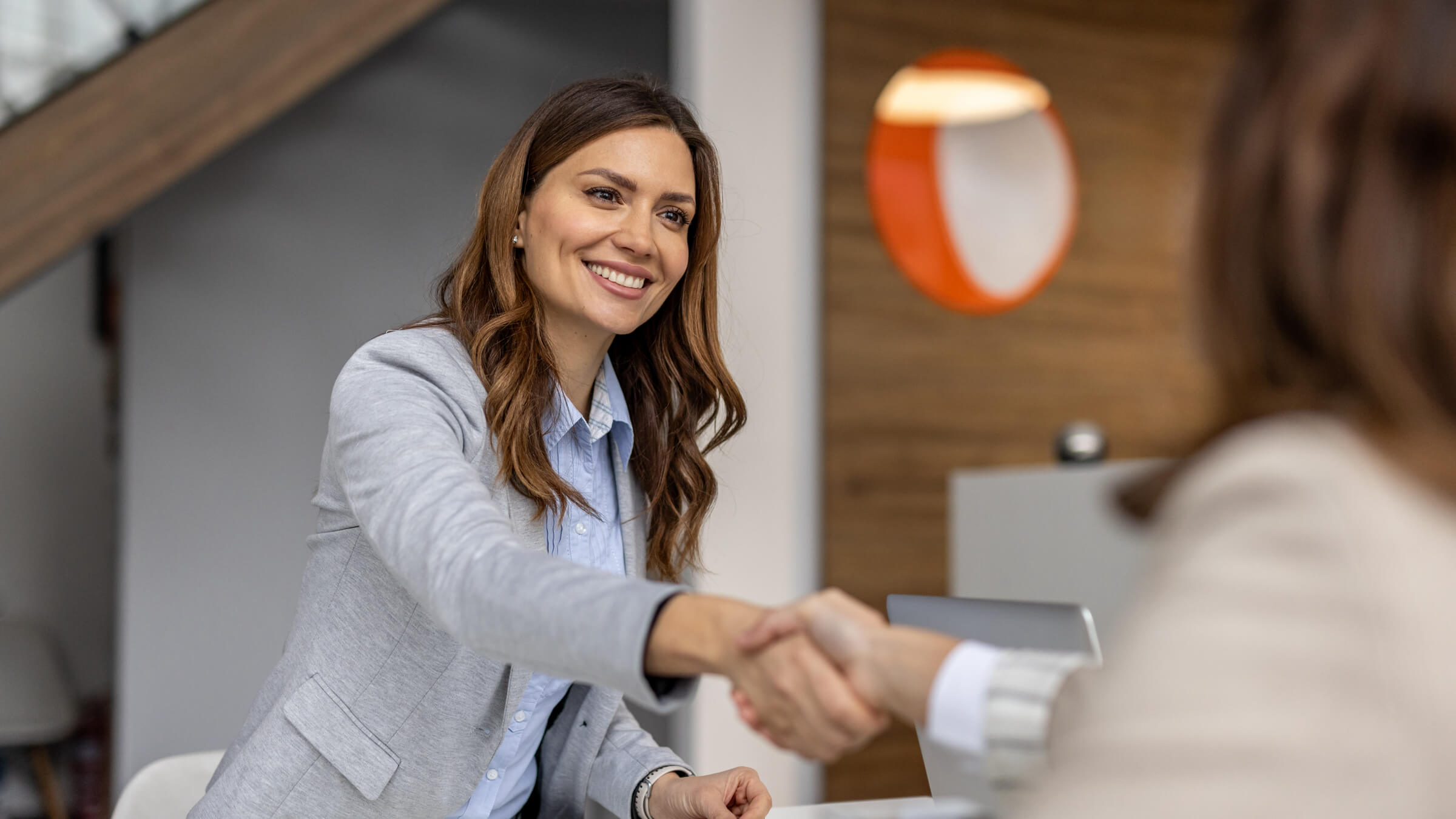 woman business meeting header@2x