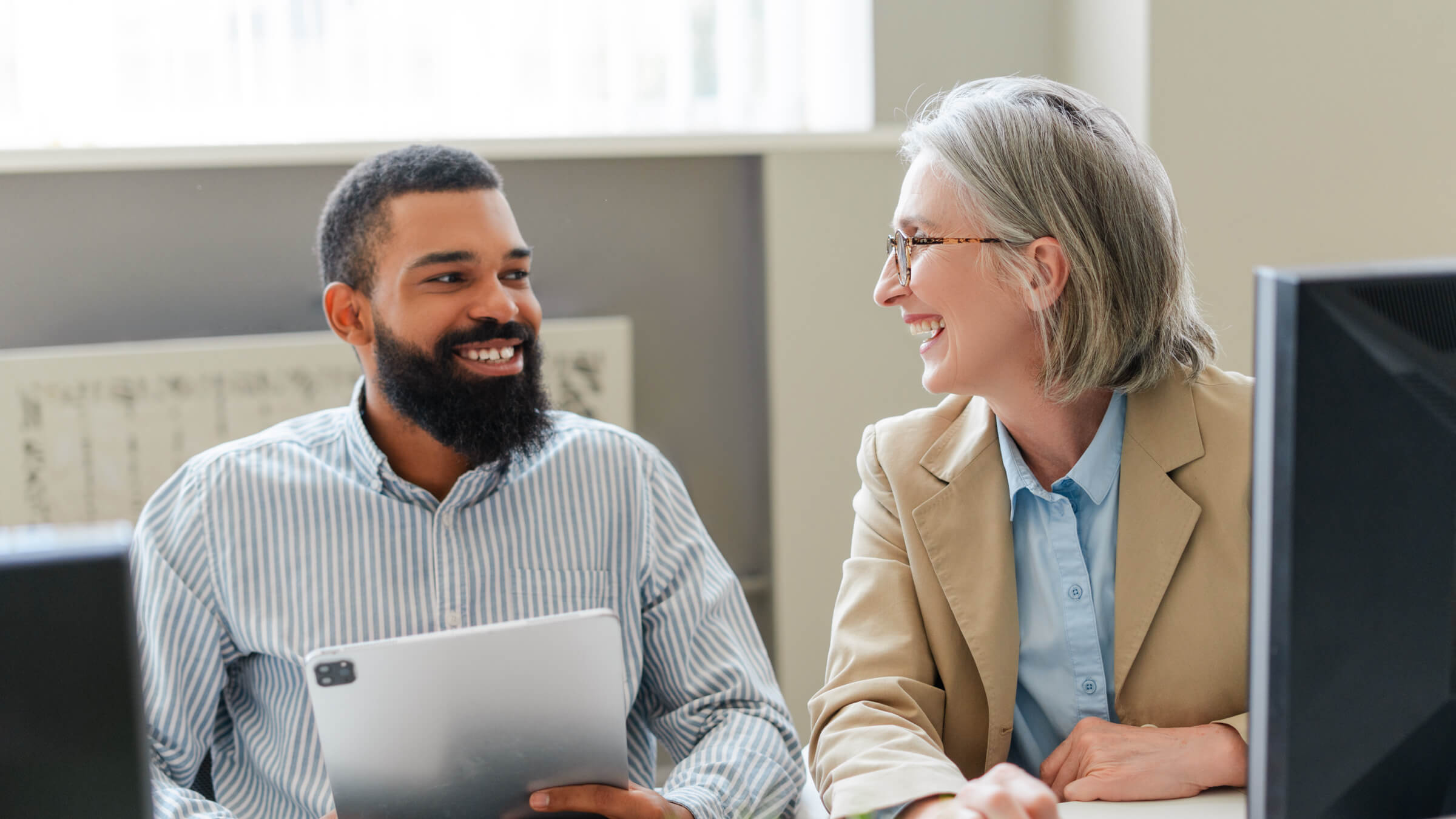man and woman view office header man and woman view office header
