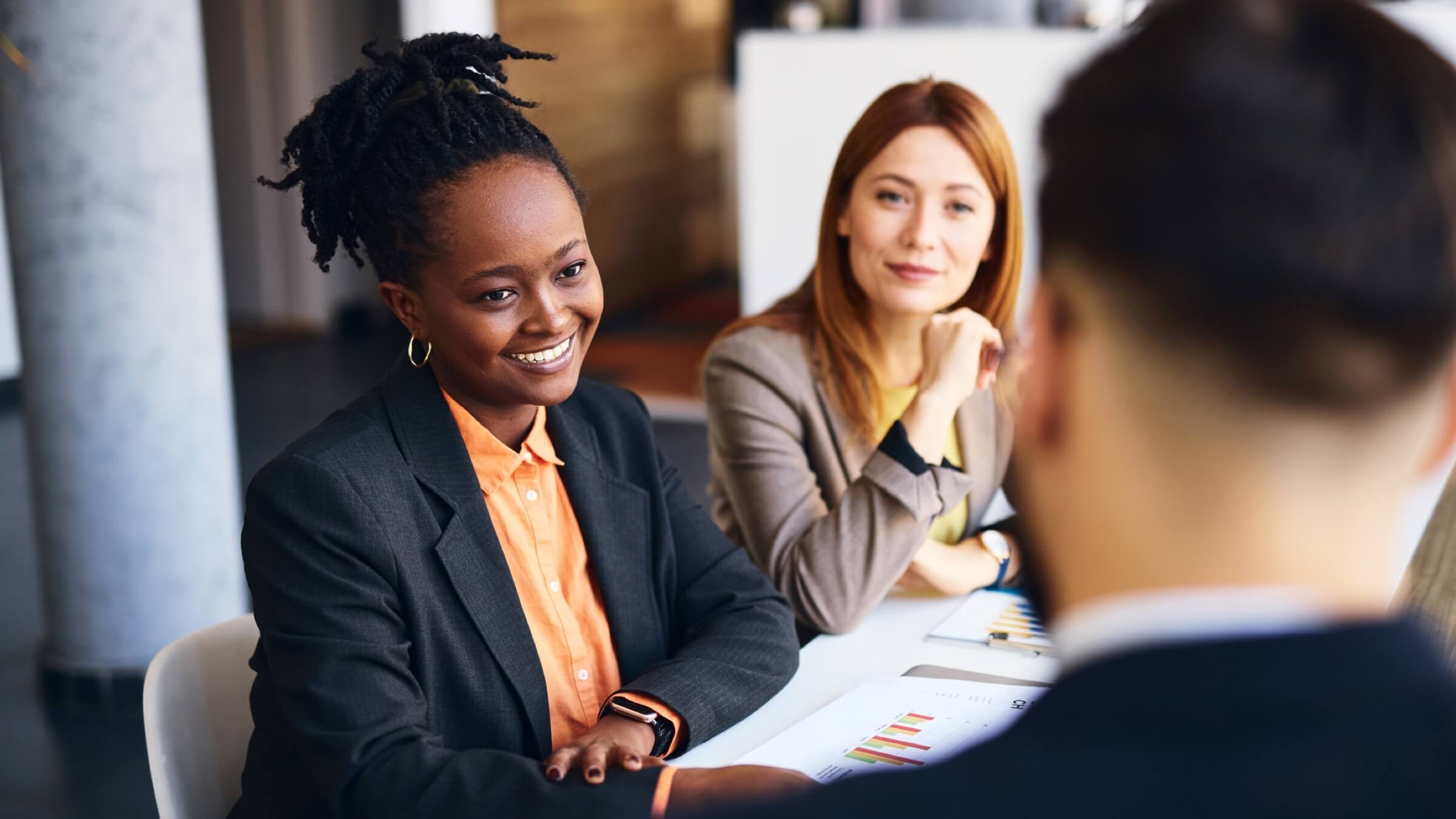two women consulting on finances header