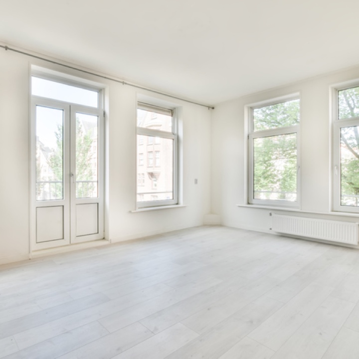 empty white room with windows