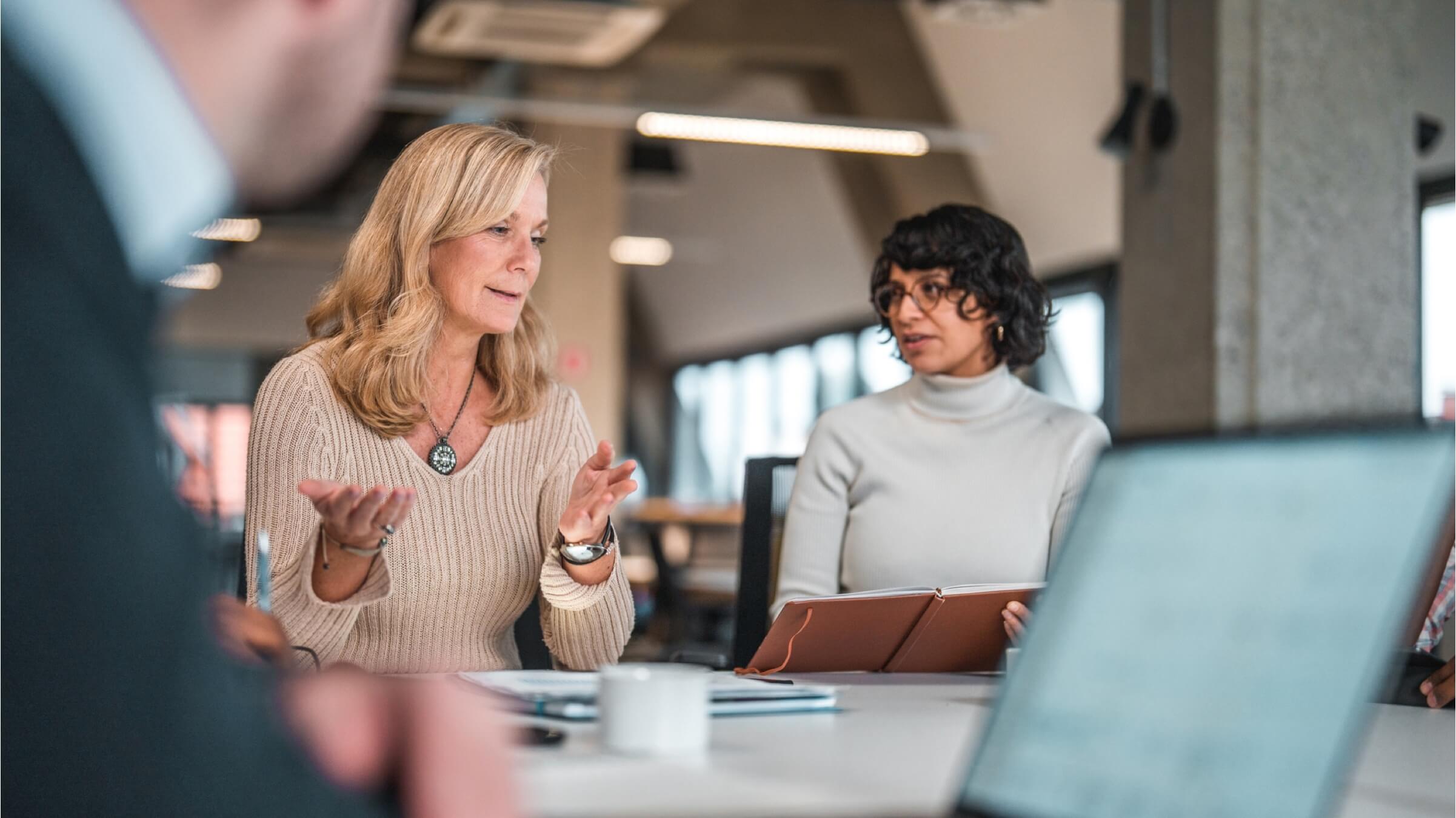 female coworkers discussing ideas header