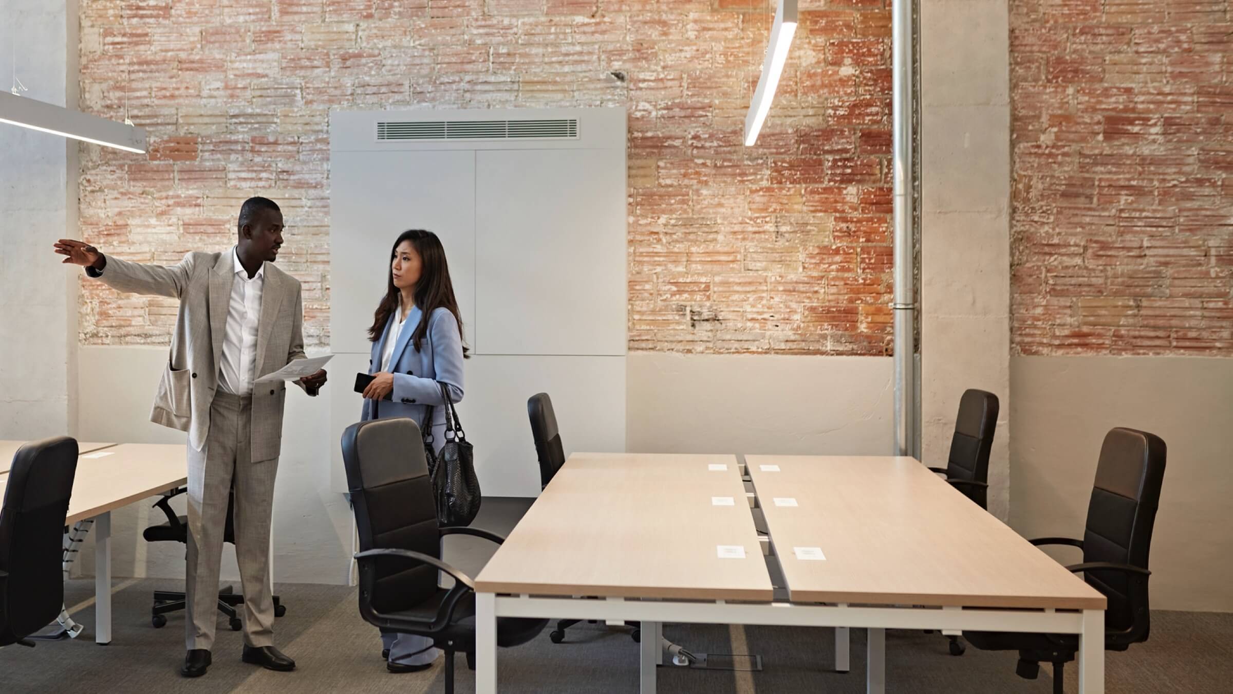 man and woman view office header