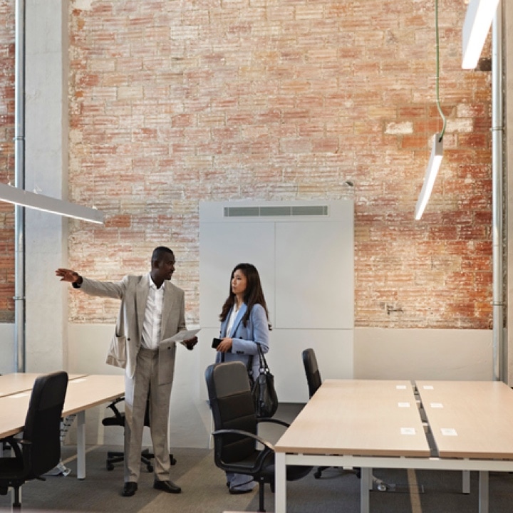 man and woman view office@2x