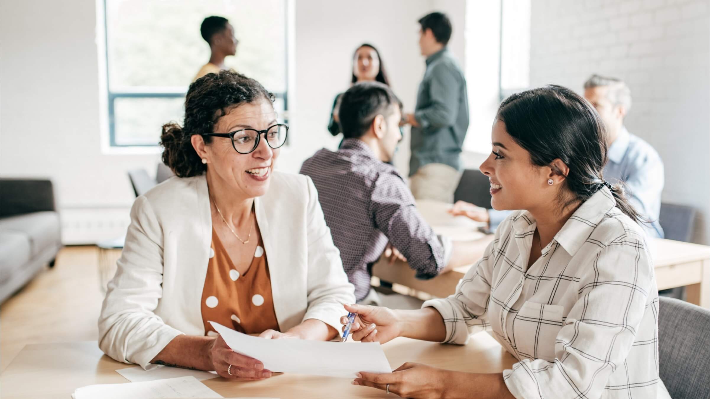 two women non profit business meeting header