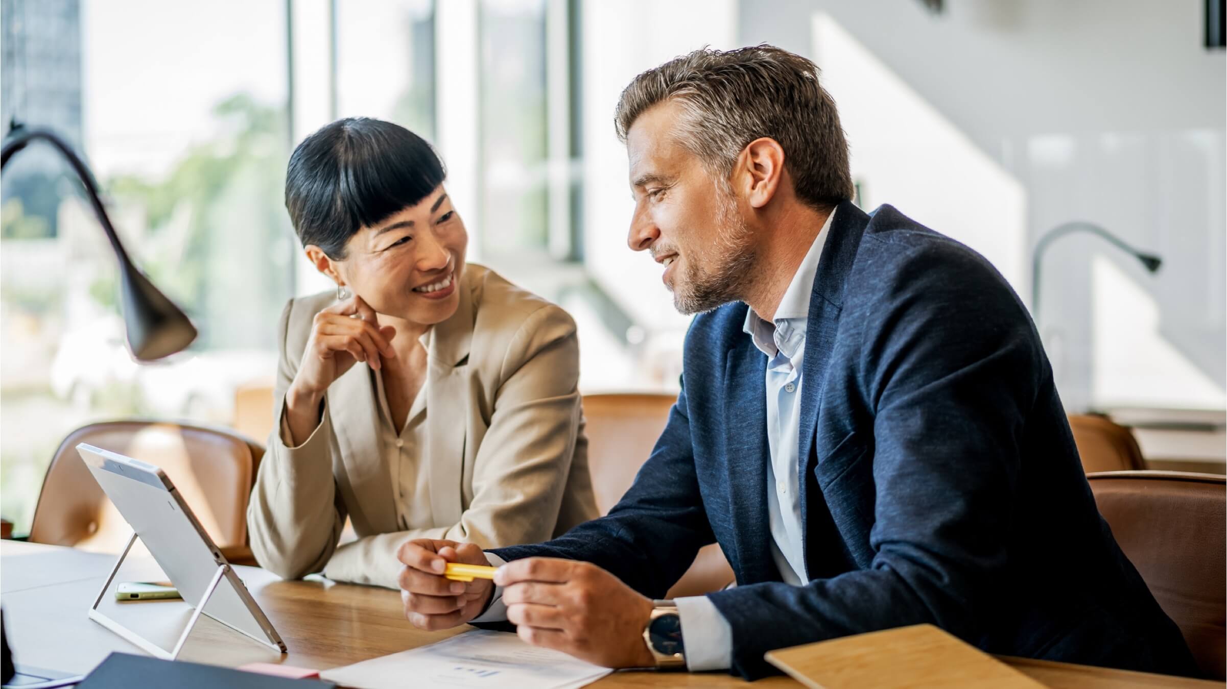 man and woman discuss finances header