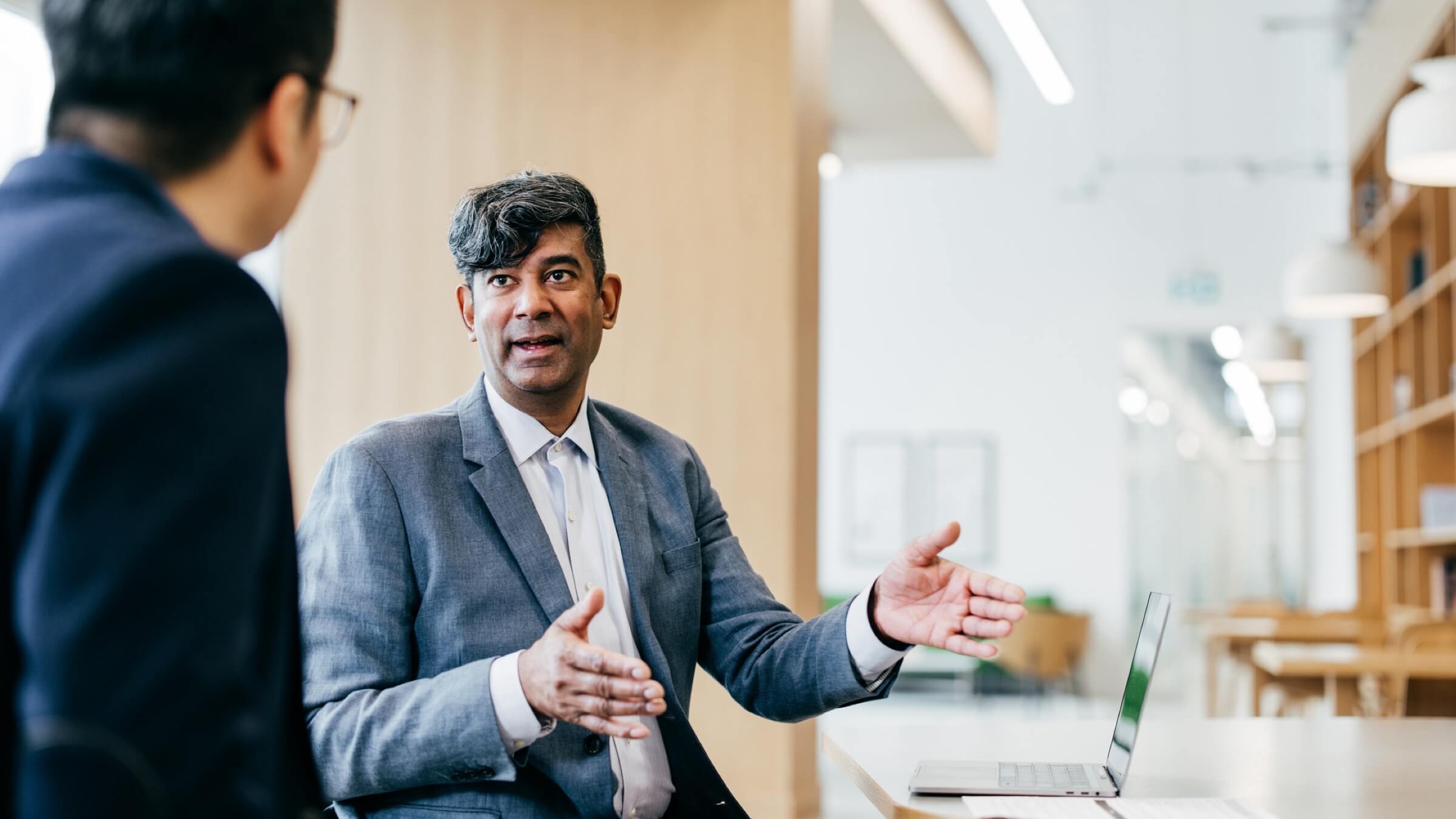 two men discussing finances header