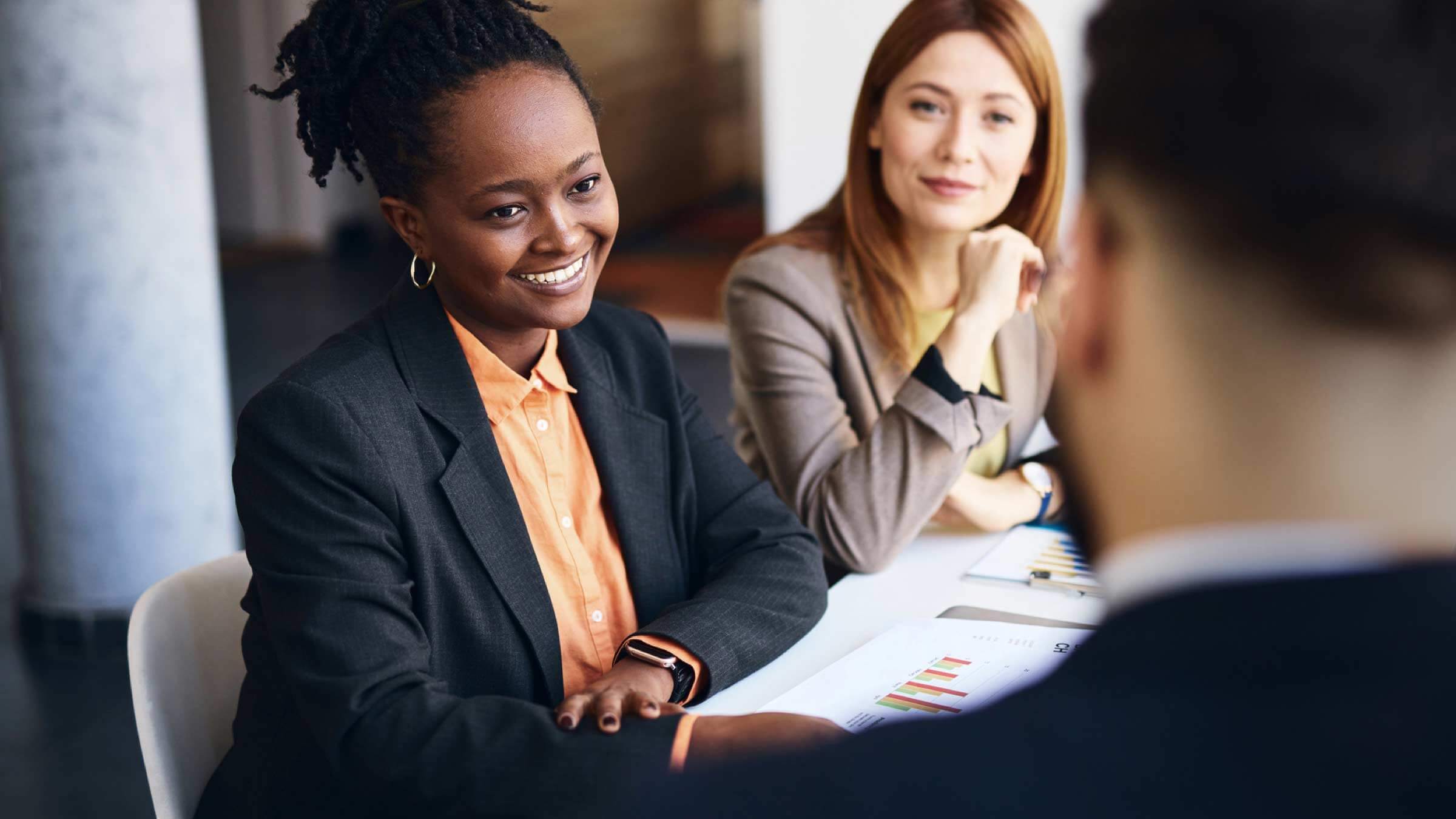 two women consulting on finances header