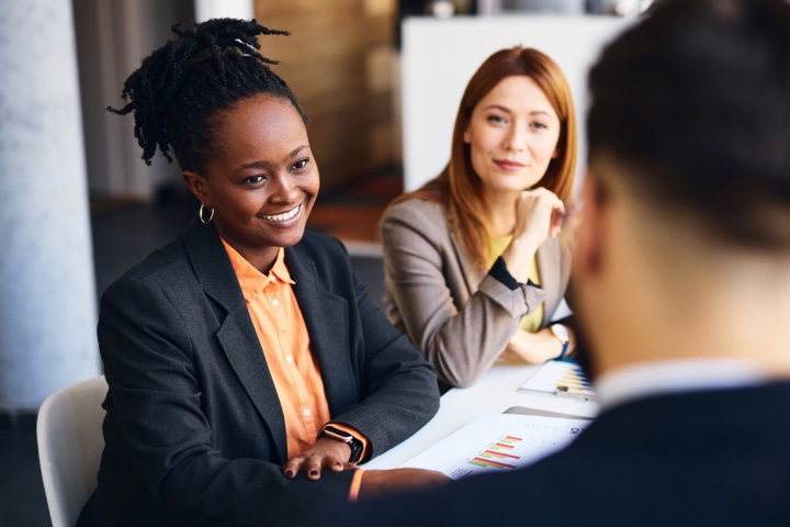 two women consulting on finances@2x
