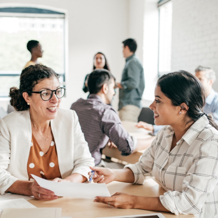 two women non profit business meeting